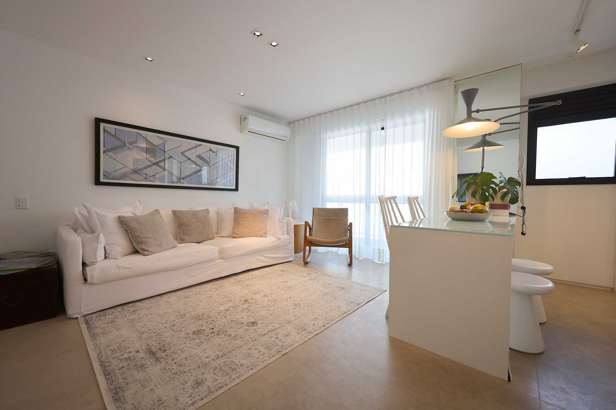 Renovated flat designed by Paola Ribeiro at Posto 9, Ipanema