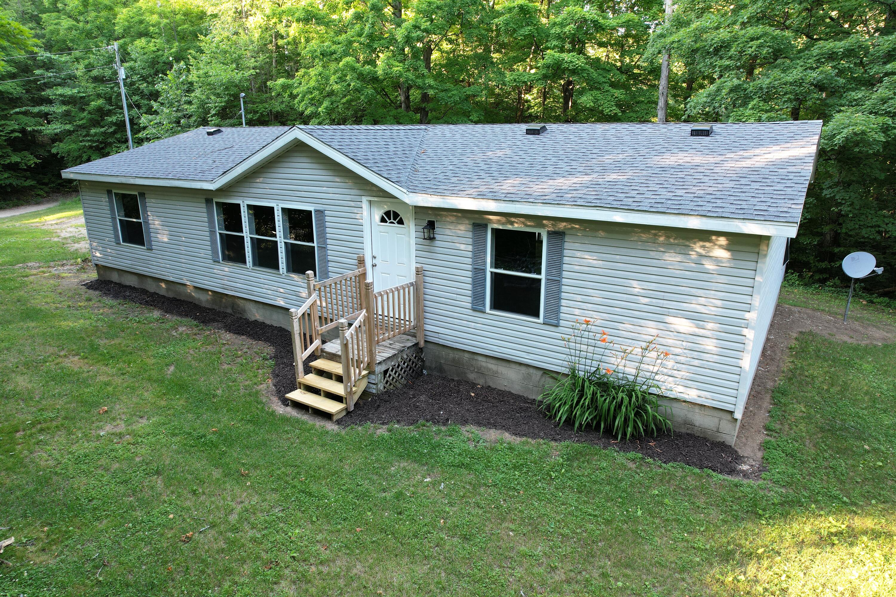 Woodland Ct, Elmira, MI 49730