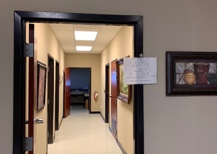 Hallway with access to multiple offices and dispatch area