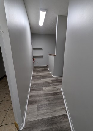 Suite D Hallway to Backdoor/ Bathroom/Stairway