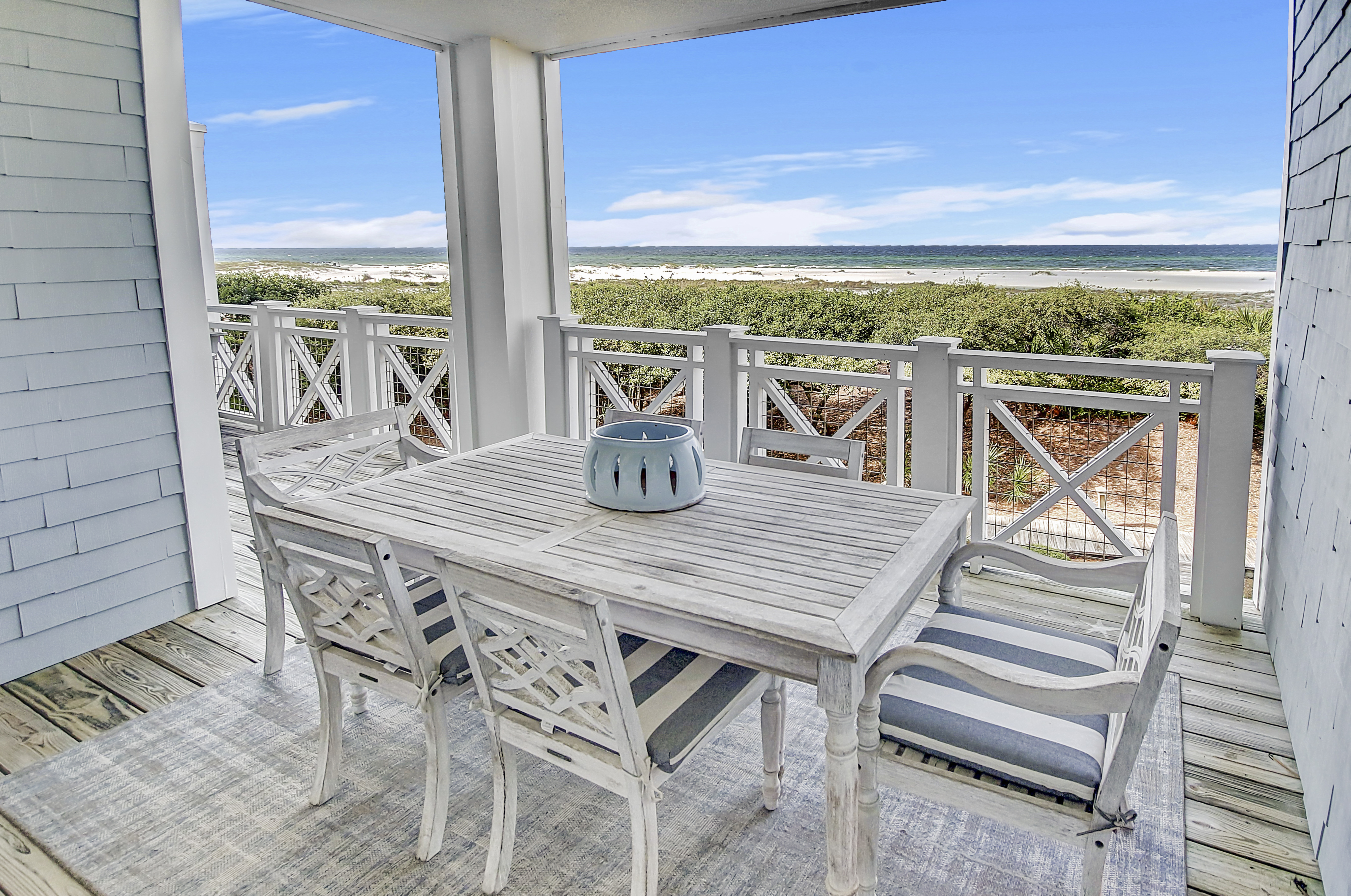 Immaculate Two-Story Residence With Porches Offering Serene Gulf Views