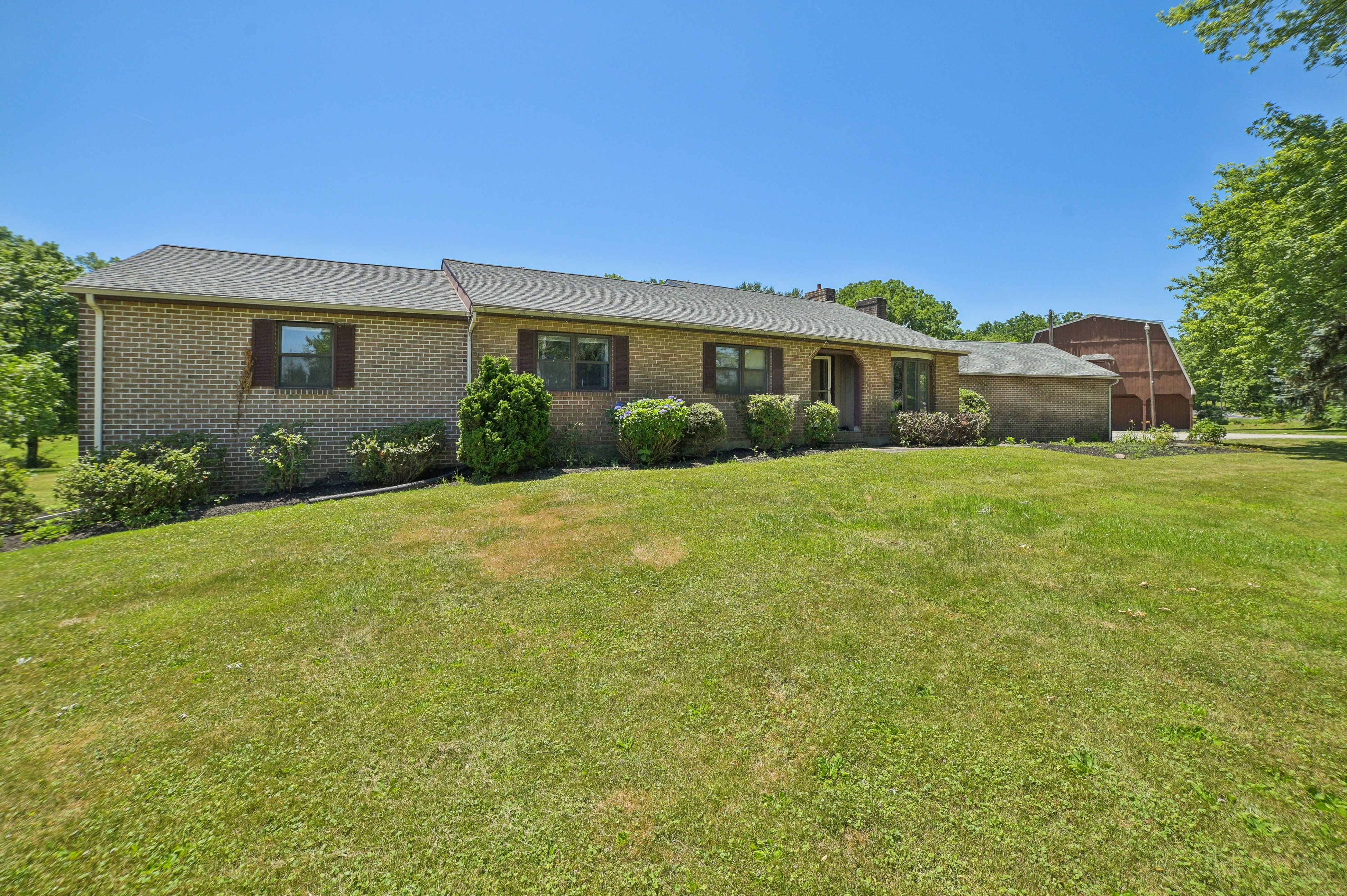 Spacious Ranch on 10.5 Acres with a Barn and Pond