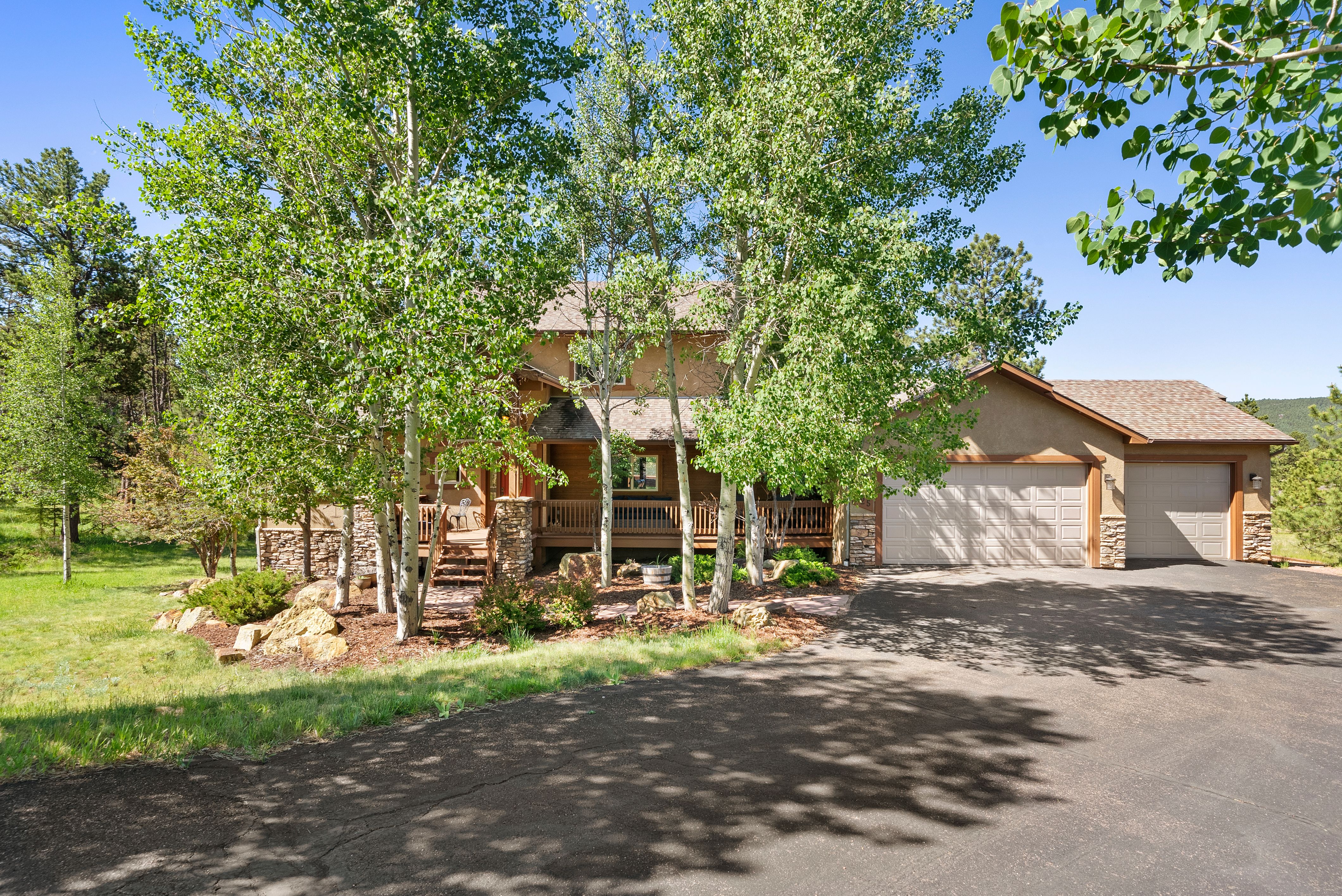 Stunning home nestled on .82 acres just minutes from Woodland Park