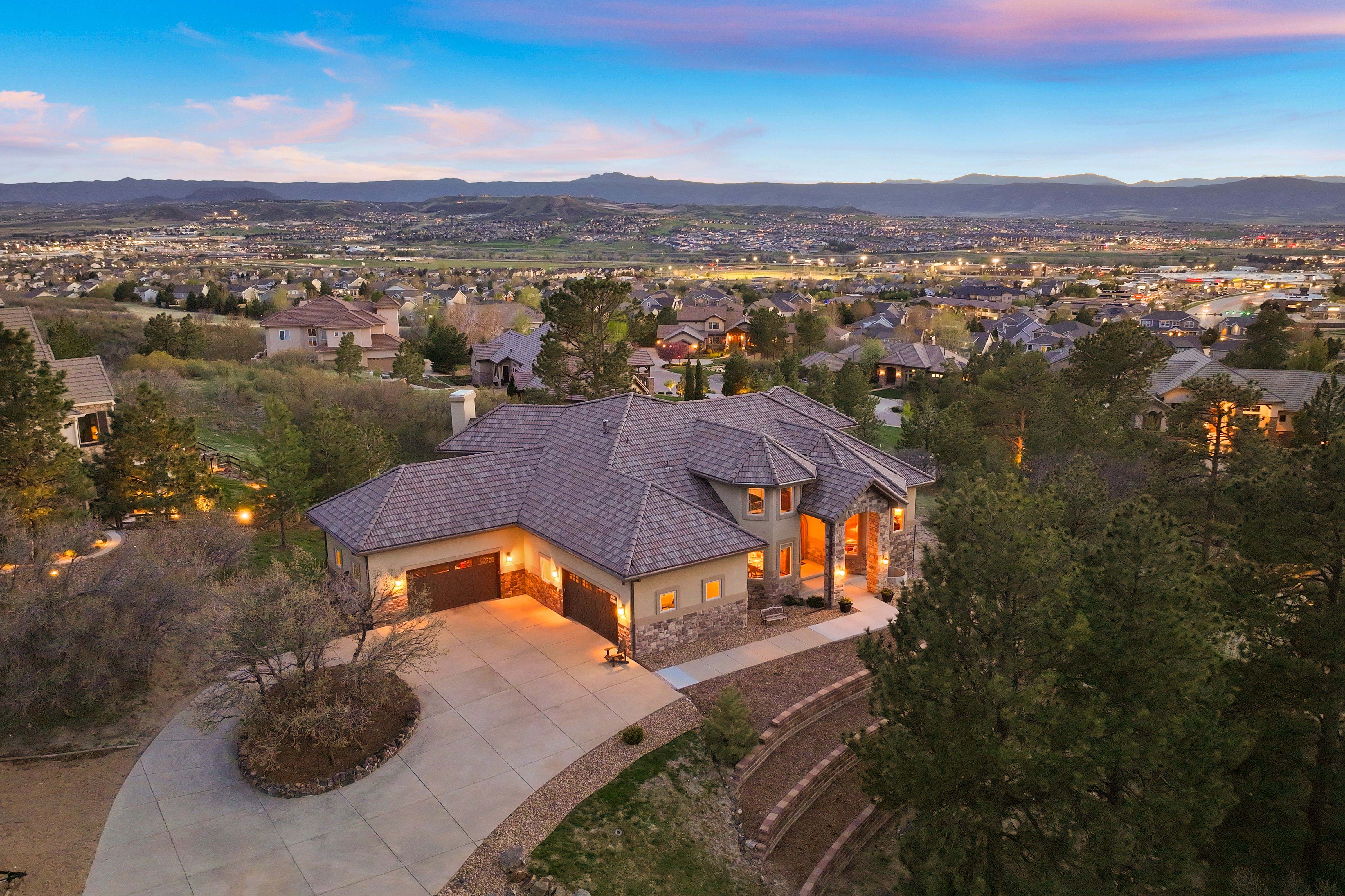 This architecturally elegant residence offers panoramic views of Pikes Peak