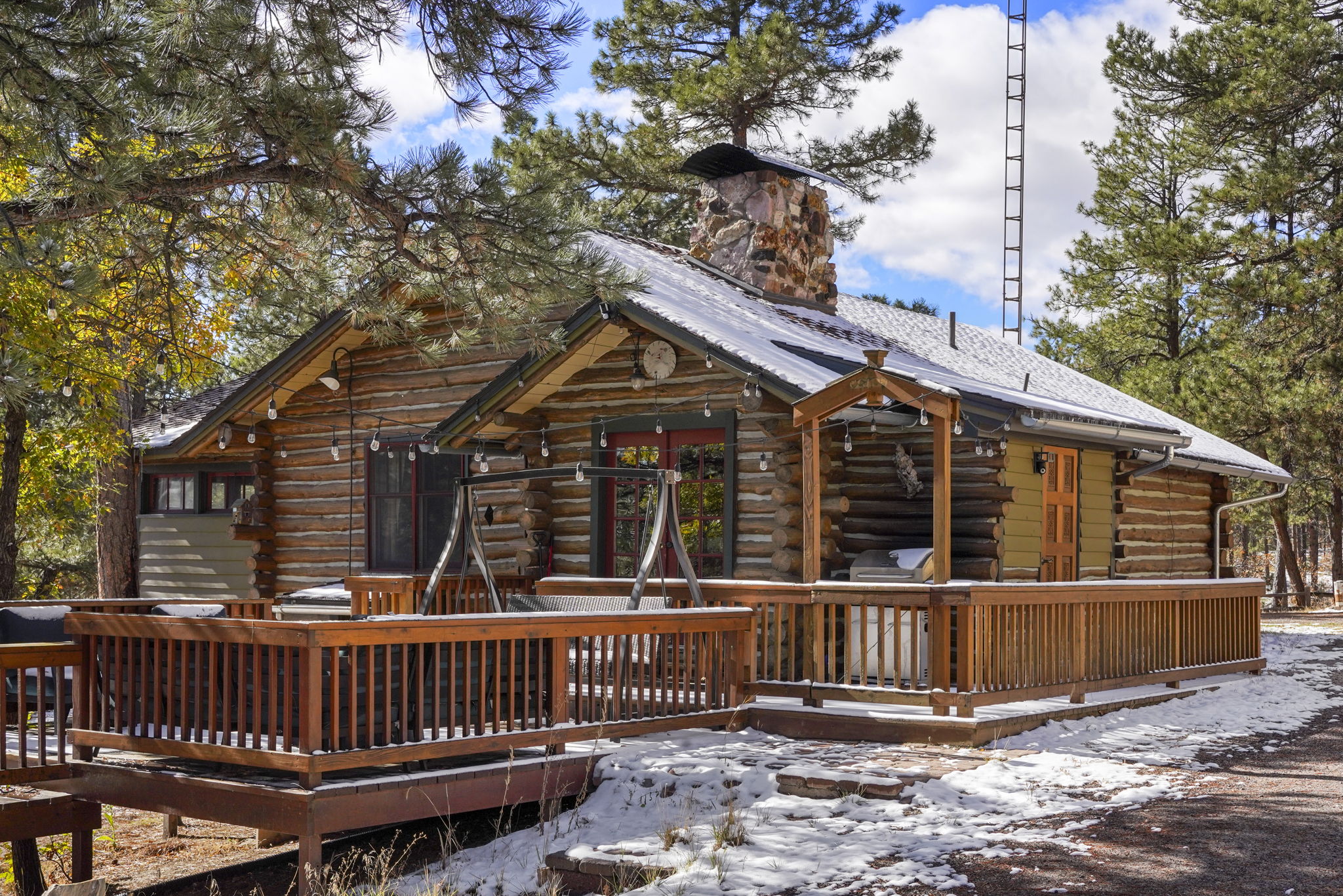 Two turn of the century charming cabins nestled in towering pines