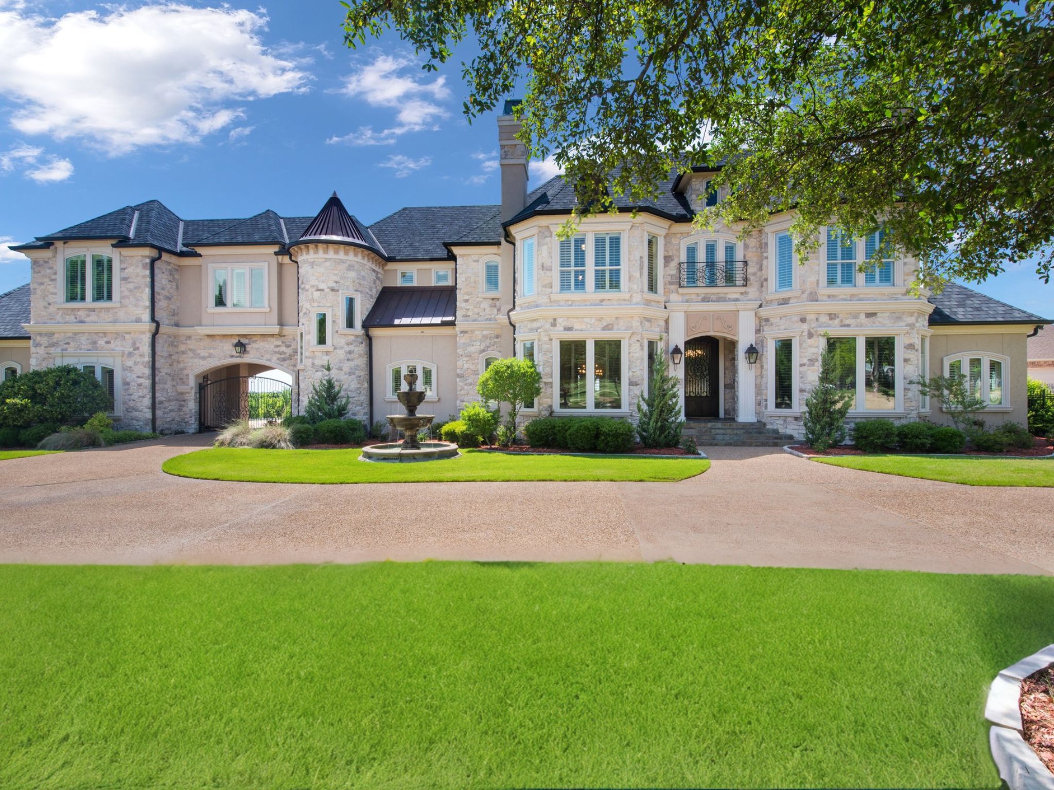 French-inspired estate w picturesque countryside sunsets in a lakeside community