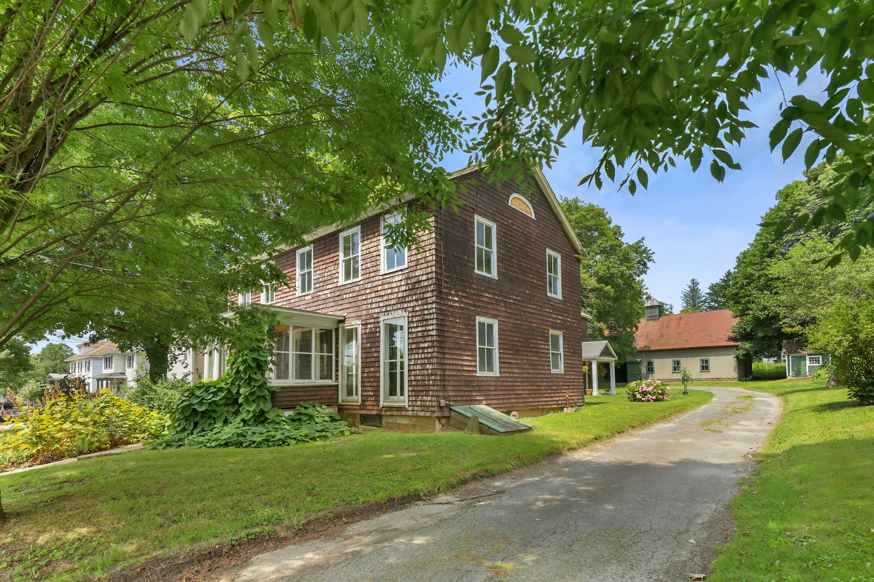 Enchanting 6-bed, 2-bath antique home with 2-story stone barn, nestled in downto