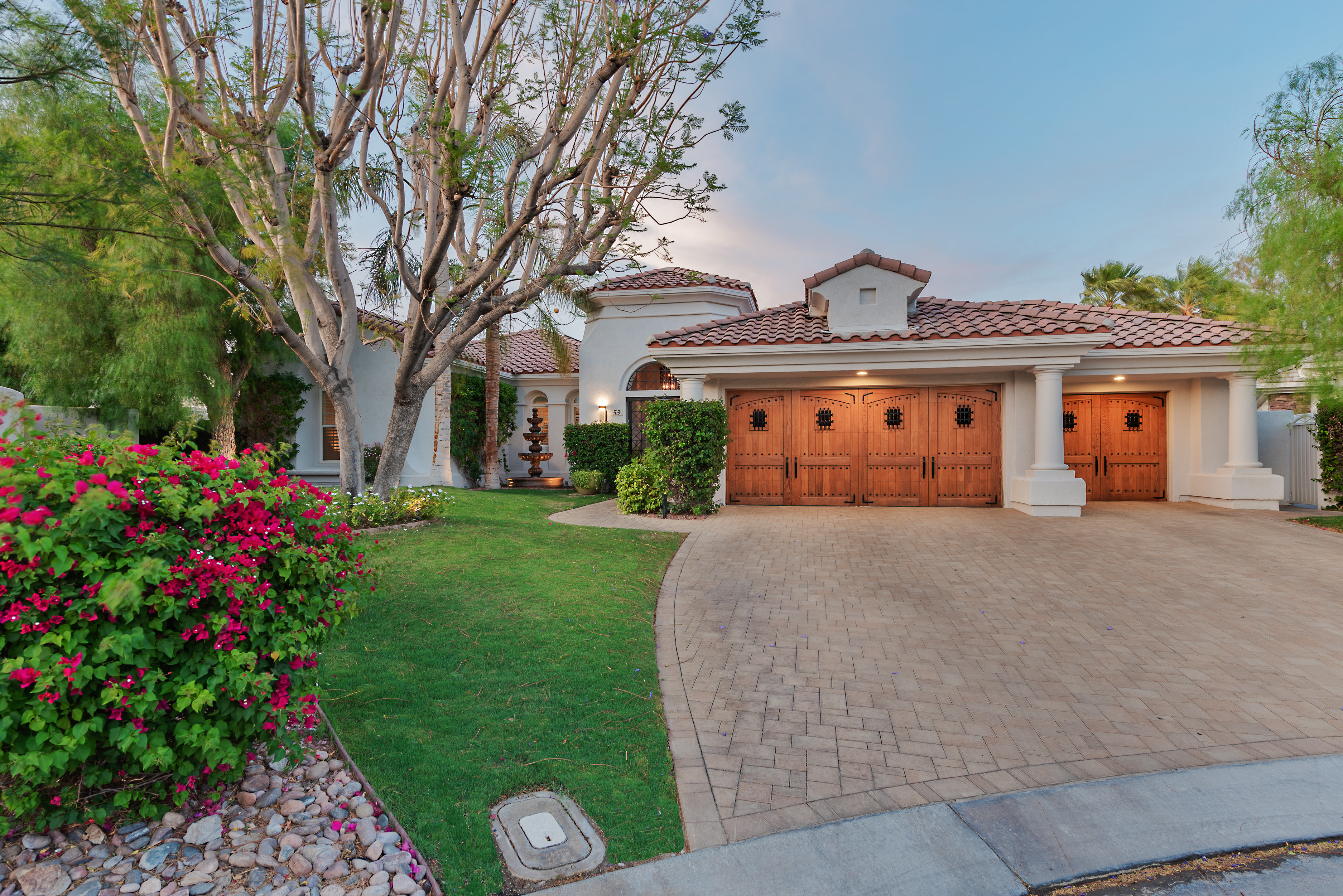 Privately situated on an over-sized lot in guard gated Mira Vista