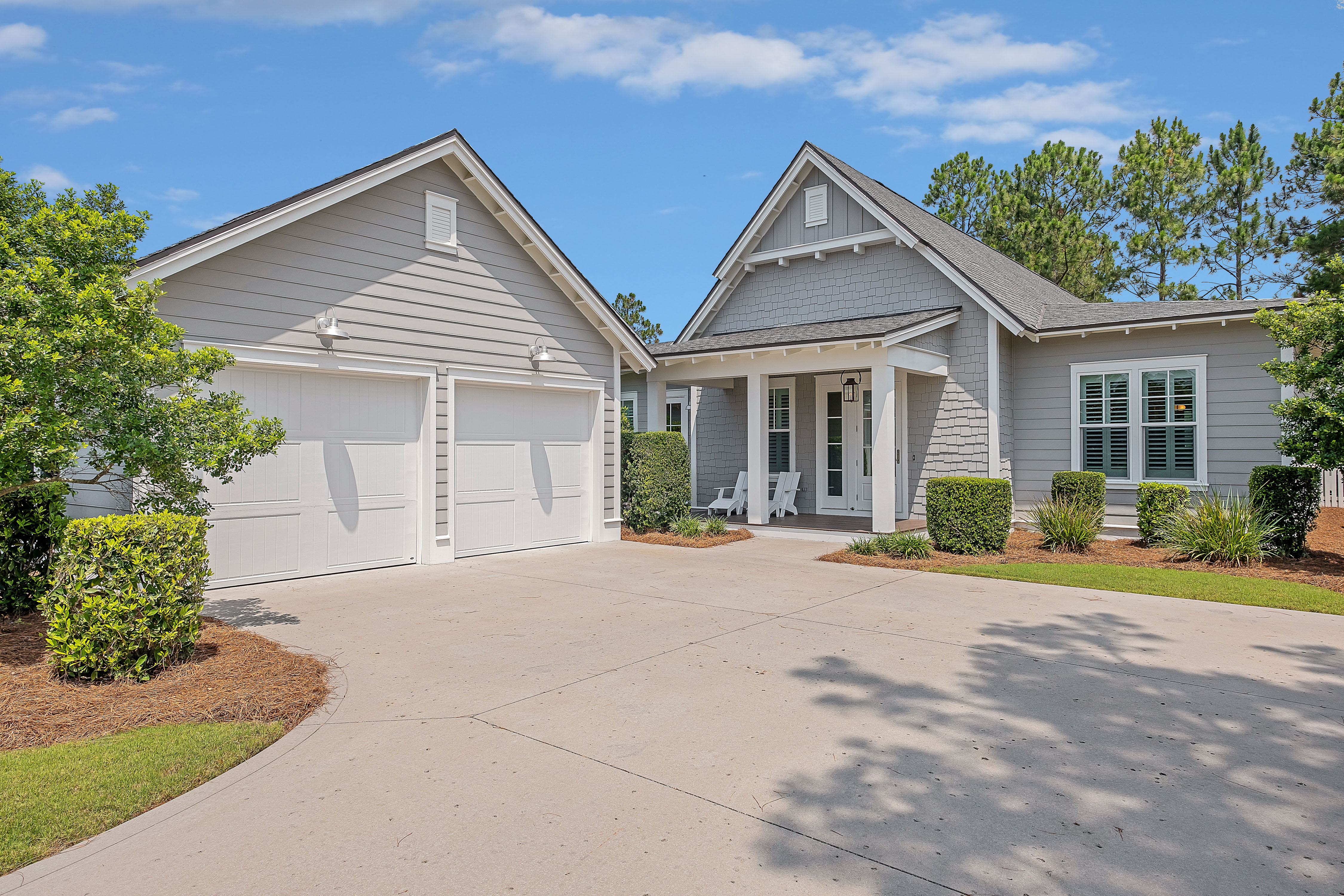 Single-Level Romair Home Backing Neighborhood Trail in WaterSound Origins