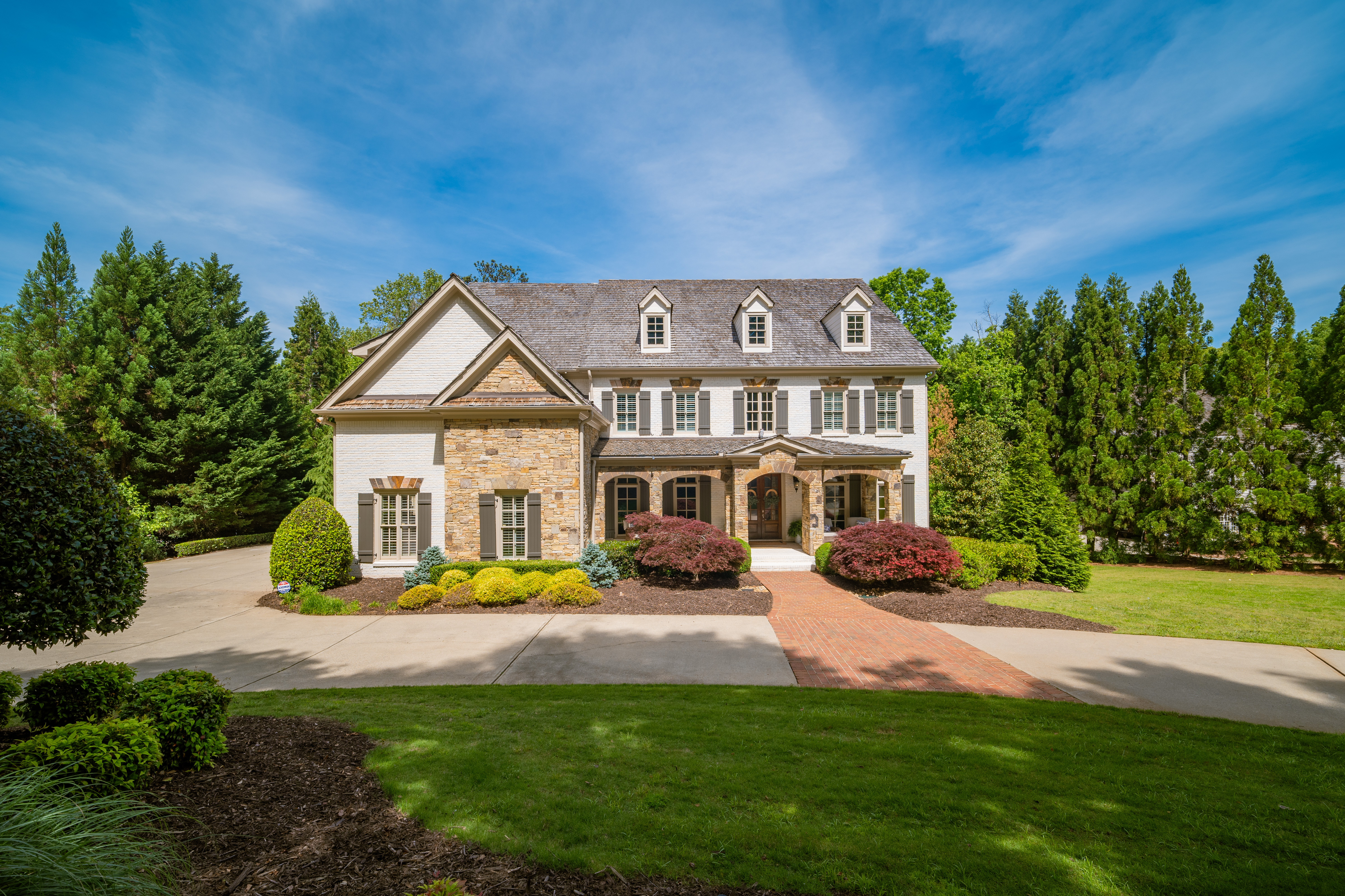 Brick and Stone Beauty in Sought After Six Hills