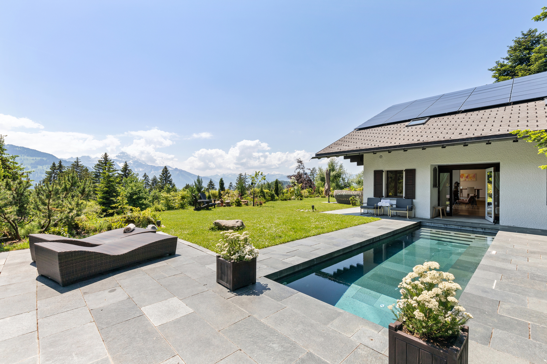 Spacious chalet with heated swimming pool and large green park