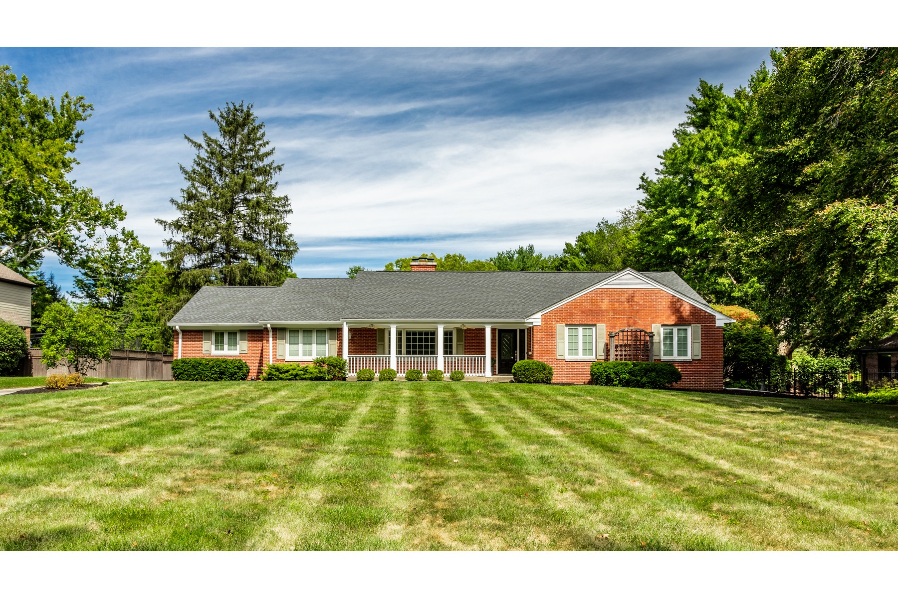 Brick Ranch Nestled Among Mature Trees In A Tranquil Setting