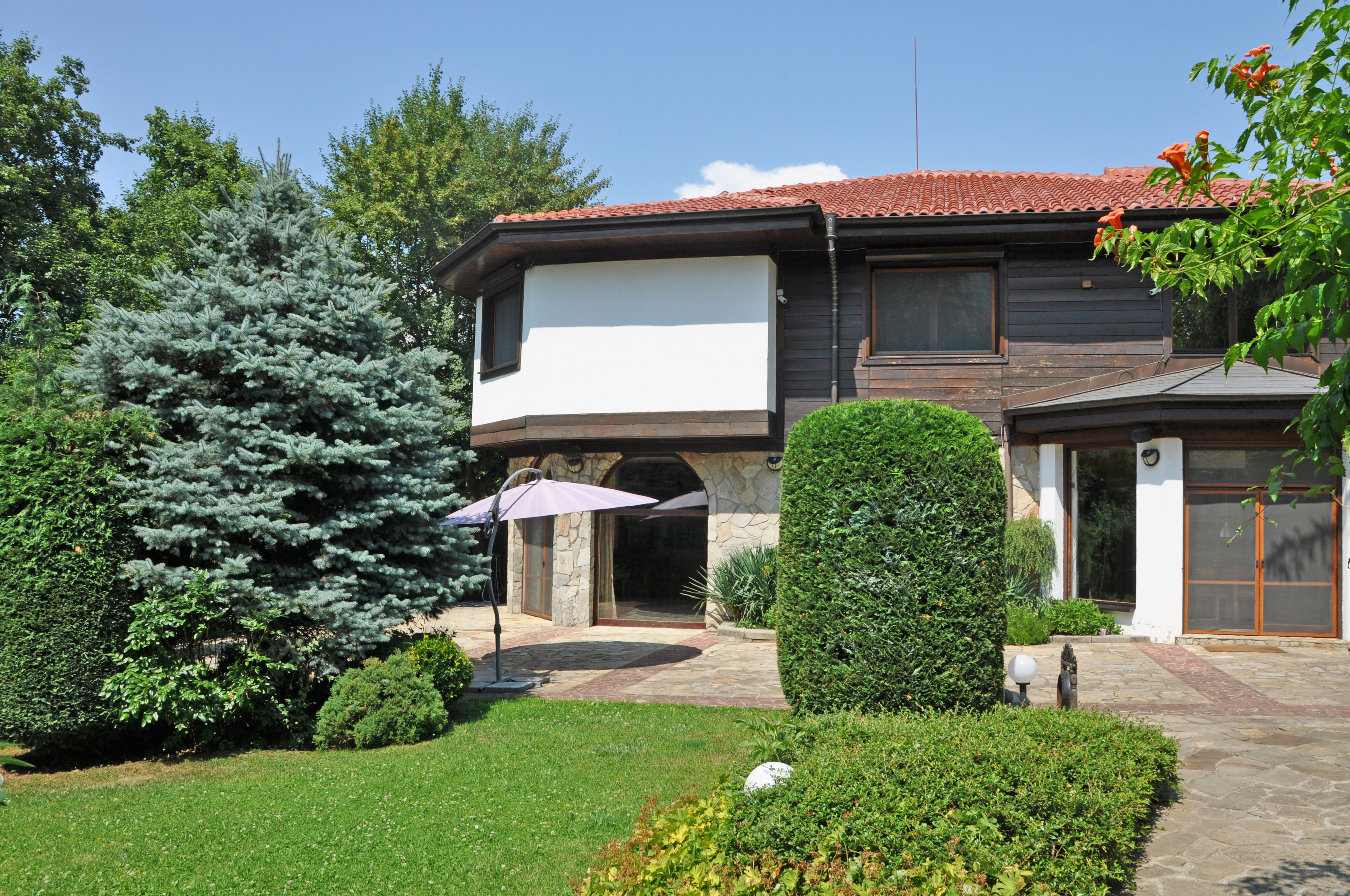 A perfect house with a well-maintained landscaped yard in Boyana