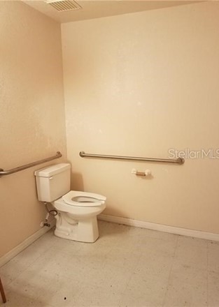 Toilet in handicap bathroom.